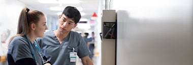 Two nurses speaking at hospital